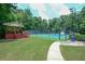 Sidewalk leading to the community's tennis court and covered viewing stand with ample seating at 1304 Carrington Way, Lawrenceville, GA 30044