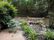 Landscaped backyard with small rock garden and privacy fence at 351 Oak Harbor Trl, Marietta, GA 30066