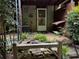 Backyard with small patio, rock garden, and AC unit adjacent to the main house at 351 Oak Harbor Trl, Marietta, GA 30066
