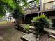 Exterior backyard featuring a rock garden, patio, and an elevated patio area in the background at 351 Oak Harbor Trl, Marietta, GA 30066