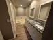 A spacious bathroom with double vanities and a separate tub, perfect for relaxation at 351 Oak Harbor Trl, Marietta, GA 30066