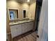 Bathroom featuring a double vanity with granite countertops and modern fixtures, showcasing functionality at 351 Oak Harbor Trl, Marietta, GA 30066