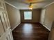 A spacious bedroom featuring modern laminate floors, neutral paint, and ample natural light from the window at 351 Oak Harbor Trl, Marietta, GA 30066