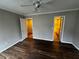A spacious bedroom featuring modern laminate floors, neutral paint, and access to a bathroom at 351 Oak Harbor Trl, Marietta, GA 30066