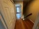 Hallway view featuring bamboo floors, closet storage and a view into an adjacent room at 351 Oak Harbor Trl, Marietta, GA 30066
