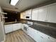 Bright kitchen with white cabinets, granite countertops, modern appliances, and stylish flooring at 351 Oak Harbor Trl, Marietta, GA 30066