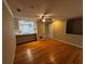 Inviting living area featuring hardwood floors, ample natural light, and an open layout to the kitchen at 351 Oak Harbor Trl, Marietta, GA 30066