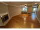 Cozy living room with hardwood floors, a fireplace, and an open floor plan at 351 Oak Harbor Trl, Marietta, GA 30066