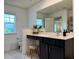 Well-lit bathroom featuring a vanity with storage, a large mirror, and modern fixtures, creating a functional space at 3836 Saddle Hill Way, Douglasville, GA 30135