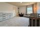 Neutral Bedroom with gray carpet, changing table and a cozy window seat for reading and relaxing at 3836 Saddle Hill Way, Douglasville, GA 30135