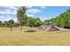 Community playground with slides and mature trees in a Gathering-friendly neighborhood at 3836 Saddle Hill Way, Douglasville, GA 30135