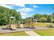 Community playground featuring slides, climbing structures, and picnic tables for outdoor enjoyment at 3836 Saddle Hill Way, Douglasville, GA 30135