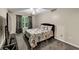 Cozy bedroom with a patterned comforter, a ceiling fan and a large window offering natural light at 4375 Split Creek Dr, Douglasville, GA 30135