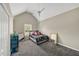 Well-lit bedroom with a vaulted ceiling, fan, and a window accented by the bright LED strip lights at 4375 Split Creek Dr, Douglasville, GA 30135