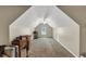 Large bonus room with carpet, a ceiling fan, dormer window, and ample storage, ideal for a playroom at 4375 Split Creek Dr, Douglasville, GA 30135