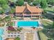 Stunning community pool and recreation center with lounge chairs, landscaping, and outdoor dining area at 4375 Split Creek Dr, Douglasville, GA 30135