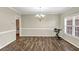 Spacious dining room with natural light, featuring modern floors and classic trim at 4375 Split Creek Dr, Douglasville, GA 30135