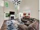 Bright living room with a cozy fireplace, high ceilings, and an open layout at 4375 Split Creek Dr, Douglasville, GA 30135