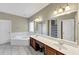 Bright primary bathroom with double vanity, soaking tub, and a separate shower at 4375 Split Creek Dr, Douglasville, GA 30135