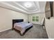 Calm primary bedroom boasting trey ceiling, soft carpet, and lots of natural light at 4375 Split Creek Dr, Douglasville, GA 30135