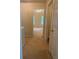Hallway leading to a bedroom featuring carpet flooring and neutral wall colors at 2858 Parkway Close, Lithonia, GA 30058