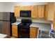 Functional kitchen with stainless steel appliances, wood cabinets, and a sink at 2858 Parkway Close, Lithonia, GA 30058