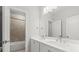Bright bathroom with double sinks and a neutral-toned tiled shower at 240 Walker Ave, Roswell, GA 30076
