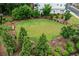 Aerial view of dog park with mature trees, landscaping, and bench at 240 Walker Ave, Roswell, GA 30076