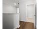 Hallway with hardwood floors, leading to rooms with natural light at 240 Walker Ave, Roswell, GA 30076