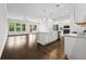 Bright living and dining area featuring an open floor plan and modern kitchen at 240 Walker Ave, Roswell, GA 30076