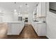 Bright kitchen with stainless steel appliances and island, open to dining and living area at 240 Walker Ave, Roswell, GA 30076