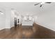Open-concept living room boasts hardwood floors and seamlessly connects to the modern, well-equipped kitchen at 240 Walker Ave, Roswell, GA 30076