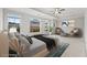 Staged main bedroom featuring large windows, a ceiling fan, and an airy ambiance at 240 Walker Ave, Roswell, GA 30076