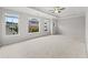 Bright main bedroom with large windows and neutral carpeting offers a serene and inviting atmosphere at 240 Walker Ave, Roswell, GA 30076