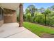 Covered patio with brick column, green lawn, and black metal fence at 240 Walker Ave, Roswell, GA 30076