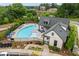 Aerial view of the community pool with chairs and umbrellas at 240 Walker Ave, Roswell, GA 30076