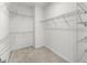 Well-lit walk-in closet with carpet and wire shelving at 240 Walker Ave, Roswell, GA 30076