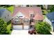An attractive home boasts a well-maintained roof, landscaping, and a spacious two-car garage at 3740 Lake Enclave Way, Atlanta, GA 30349