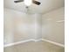 Cozy bedroom featuring neutral paint, carpeted floors, and a ceiling fan at 3740 Lake Enclave Way, Atlanta, GA 30349