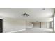 Spacious bonus room with neutral paint, plush carpet, and modern ceiling fixture at 3740 Lake Enclave Way, Atlanta, GA 30349