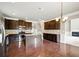 The spacious kitchen features granite countertops, stainless steel appliances, and a central island at 3740 Lake Enclave Way, Atlanta, GA 30349