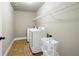 Laundry room featuring tile floors, a utility sink, and appliances with plenty of room for storage at 3740 Lake Enclave Way, Atlanta, GA 30349