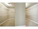 Walk-in closet featuring carpet floors and ventilated shelving for ample storage at 3740 Lake Enclave Way, Atlanta, GA 30349