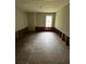 Unfinished basement with tile flooring and exposed wall framing at 3796 Melvin Sw Dr, Atlanta, GA 30331