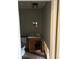 Small bathroom with a toilet, sink, vanity, light fixture, and damaged walls and flooring at 3796 Melvin Sw Dr, Atlanta, GA 30331