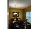 Cozy dining room with dark wood floors and decorative lighting fixture at 3796 Melvin Sw Dr, Atlanta, GA 30331