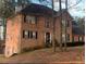 A charming two-story brick home with a well-maintained front yard and mature trees at 3796 Melvin Sw Dr, Atlanta, GA 30331