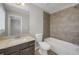 Bathroom with tiled shower, tub, and sleek vanity; features contemporary fixtures and ample space at 4204 Hardy Ave, Smyrna, GA 30082