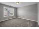 Cozy bedroom with neutral tones, carpeted floors, and a window allowing ample natural light at 4204 Hardy Ave, Smyrna, GA 30082