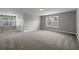 Spacious room with ample natural light, plush carpeting, and neutral decor creating a warm and inviting space at 4204 Hardy Ave, Smyrna, GA 30082